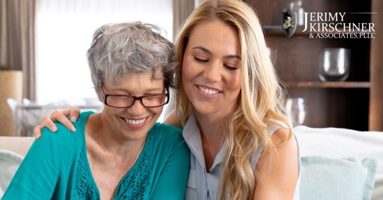 Adult woman hugging her older mother